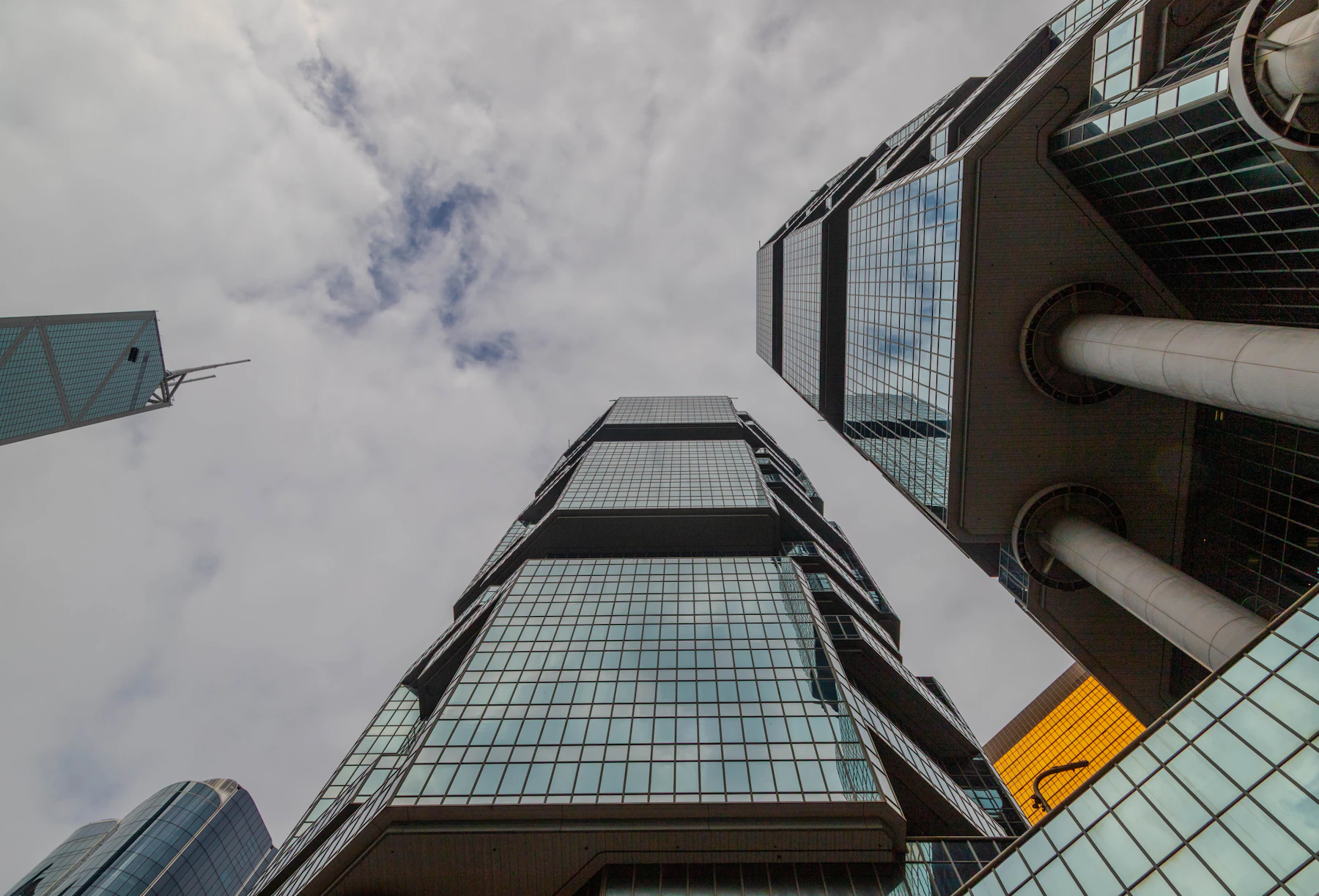 Layered glass towers viewed from below in Admiralty, Hong Kong