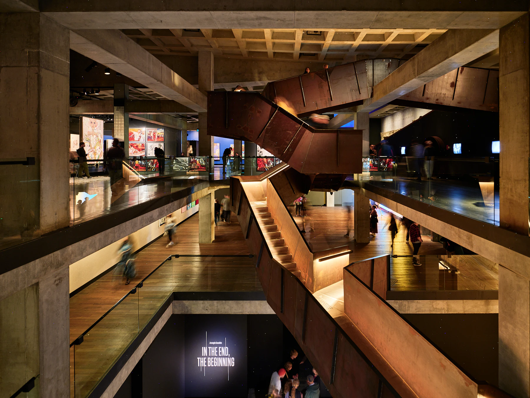 Layered walkways, stairs and warm architectural lighting inside the MONA museum in Tasmania